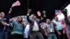 Gubernur Puerto Rico, Ricardo Rosello merayakan hasil referendum bersama dengan anggota Kongres AS Jennifer Gonzalez (kiri) di markas besar partai Progresif Baru, San Juan, Puerto Rico, 11 Juni 2017. (AP Photo/Carlos Giusti). 