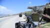 FILE - Soldiers patrol the seaport in Somalia's southern port city of Kismayo, Nov. 29, 2012.