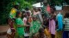 Muslim children gather at a water pump outside the mosque at PK12 in Bangui, Central African Republic, Thursday April 10, 2014.