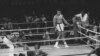 Referee Zack Clayton counts out George Foreman in round 8 of a title bout with Muhammad Ali, in Kinshasa, Zaire, Oct. 30, 1974. 