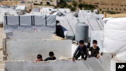 Anak-anak pengungsi Suriah di sebuah kamp pengungsi di Kota Arsal, Lebanon, 5 Agustus 2019. 