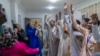 At the opening party for a law office in Cairo on Nov. 22, 2024, refugees from Sudan unite with Cairo&rsquo;s wider Sudanese community. Some 4 million Sudanese nationals lived in Egypt before Sudan&rsquo;s war erupted and forced millions to flee.