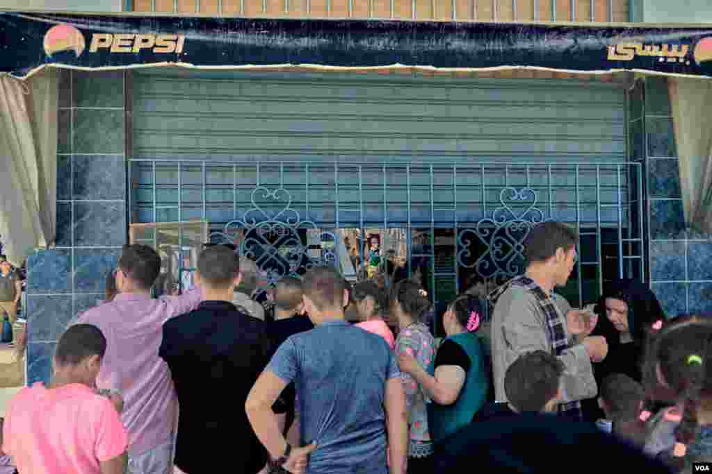 Pilgrims to Virgin Mary Monastery buy soda and mineral water to beat the extreme heat of Egypt's summer days. Sunday, August 18, 2019.