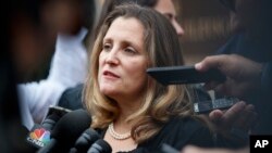 Canadian Foreign Affairs Minister Chrystia Freeland speaks to the media as she arrives at the Office of the United States Trade Representative, Sept. 11, 2018, in Washington. 