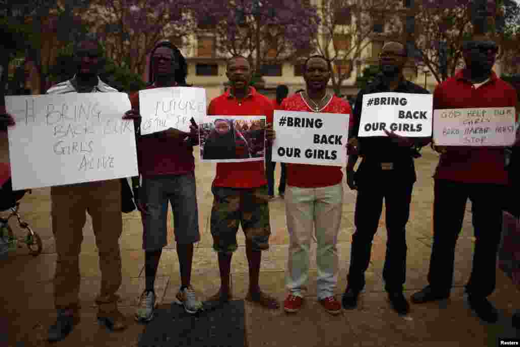 Nigerians take part in a protest, called by Malaga's Nigerian women Association, for the release of the abducted schoolgirls, at La Merced square in Malaga, southern Spain May 13, 2014. 