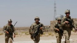FILE - U.S. troops patrol at an Afghan National Army (ANA) Base in Logar province, Afghanistan, Aug. 7, 2018.