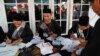 Petugas KPPS sedang menyiapkan surat suara di sebuah TPS di Bogor, 17 April 2019. (Foto: Willy Kurniawan/Reuters)
