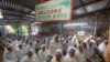 Members of Ethiopia's Jewish community gather below a banner reading "Welcome" in Amharic, English and Hebrew, to protest the Israeli decision not to allow all of them to emigrate to Israel, leaving their families divided between the two countries, in Addis Ababa, Nov. 19, 2018. 