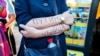 RUSSIA – A woman protests in support of Alexey Navalny with an inscription on her arms reading "Putin is a murderer." Saint Petersburg, August 21, 2020.