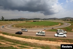 Vehicles drive on the interchange of the new Chinese-built 51-kilometer (31-mile) four-lane expressway connecting Uganda's capital Kampala to Entebbe International Airport, in Kampala, Uganda, Jan. 29, 2018.