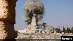 An image distributed by Islamic State militants on social media on August 25, 2015 purports to show the destruction of a Roman-era temple in the ancient Syrian city of Palmyra. Syria's antiquities chief Maamoun Abdulkarim told Reuters the images did appea