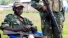 M23 rebels keep watch near a United Nations peacekeepers check point at Kanyaruchinya village, 3km north of Goma city on May 15, 2013. 