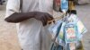 A vendor sells bags of rat poison in northern Nigeria's largest city of Kano, Jan. 18, 2016.
