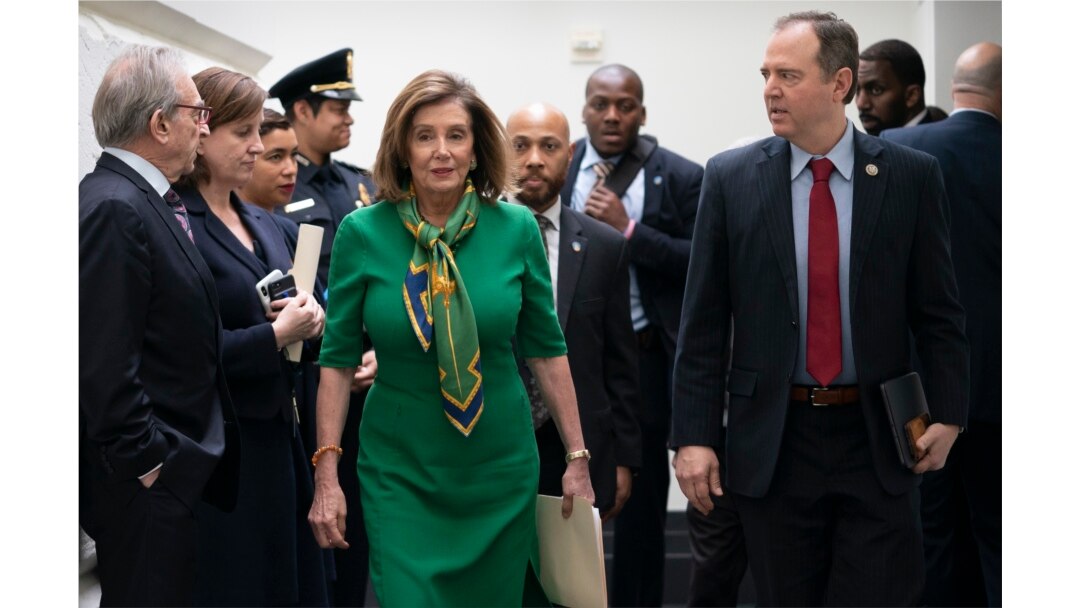 Speaker of the House Nancy Pelosi, D-Calif., joined by House Intelligence Committee Chairman Adam Schiff, D-Calif., right, leaves a lengthy closed-door meeting with the Democratic Caucus at the Capitol in Washington, Jan. 14, 2020.