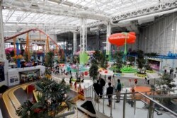 Visitors to the American Dream mega entertainment and shopping complex in East Rutherford, N.J., use the Nickelodeon Universe theme park, Friday, Oct. 25, 2019. (AP Photo/Richard Drew)