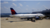FILE - A Delta Airlines passengers plane just arrived at the Ronald Reagan-Washington National airport, just outside Washington, DC. (VOA/Diaa Bekheet)