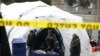 Workers construct what is believed to be a makeshift morgue behind a hospital during the coronavirus pandemic, in the Manhattan borough of New York City on March 25, 2020.
