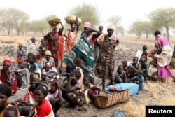 FILE - Women and children wait to be treated at a Medecins Sans Frontieres (MSF) support clinic in Thaker, Southern Unity, South Sudan, March 20, 2017.