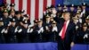 President Donald Trump waves after speaking to law enforcement officials on the street gang MS-13, July 28, 2017, in Brentwood, New York. 