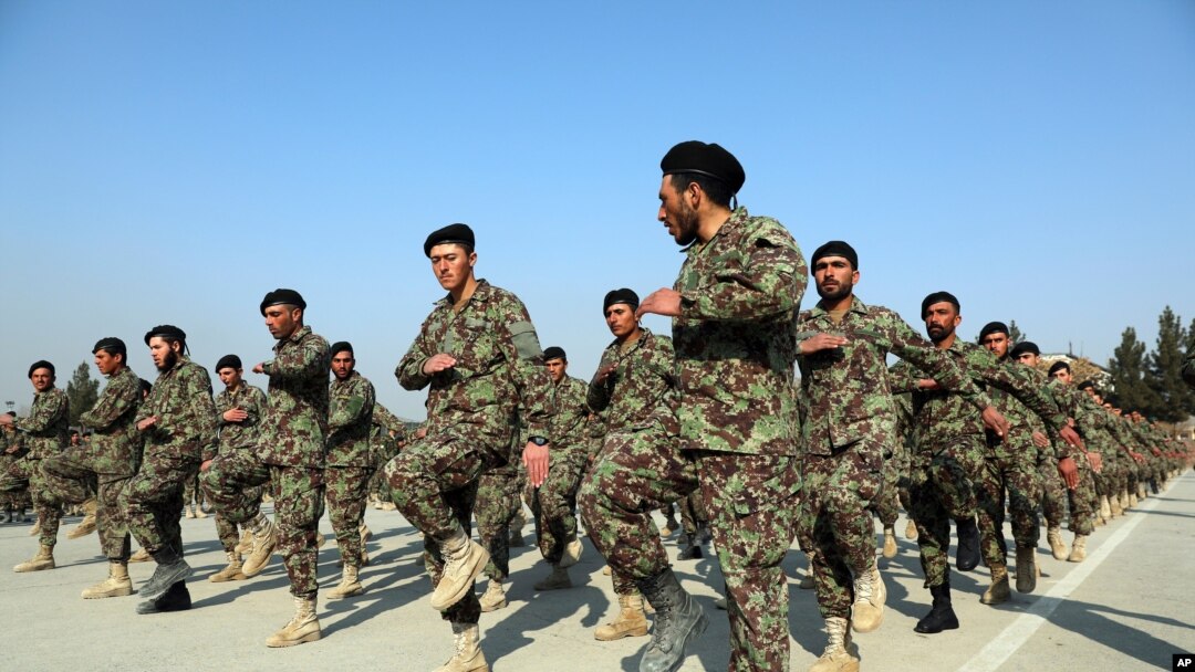 FILE - In this Jan. 18, 2021, photo, new Afghan National Army troops march during their graduation ceremony after a three-month training program at the Afghan Military Academy in Kabul, Afghanistan.