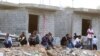 FILE - Ethiopians gather as they wait to be repatriated in Manfouha, southern Riyadh, Nov. 13, 2013. 
