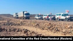 A convoy of trucks from the International Committee of the Red Cross (ICRC) are seen delivering lifesaving medical supplies on the road to Mekelle, in Tigray region, Ethiopia, Nov. 15, 2022.