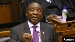FILE - President Cyril Ramaphosa delivers his State of the Nation address at Parliament in Cape Town, South Africa, Feb. 16, 2018. He has said he will speed up the transfer of land to blacks, although he has stressed that food production and security must be preserved.