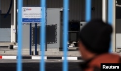A sign of the U.S. Agency for International Development (USAID) is seen at a water desalination plant in the central Gaza Strip, Feb. 1, 2019.