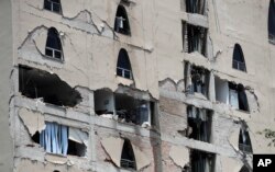 Remains of a damaged building stands after an earthquake in Mexico City, Tuesday, Sept. 19, 2017. A powerful earthquake has jolted Mexico, causing buildings to sway sickeningly in the capital on the anniversary of a 1985 quake that did major damage.