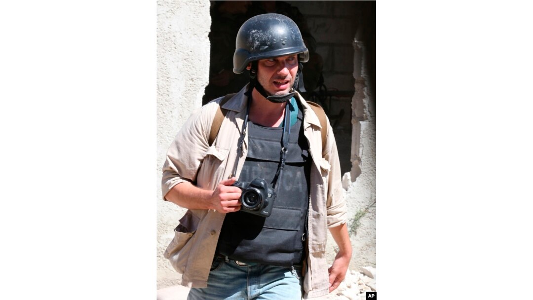 Photographer Andrei Stenin is shown working near Damascus in this 2013 provided by Syria's ITAR-TASS.