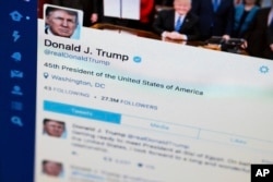 FILE - Photo shows President Donald Trump's tweeter feed on a computer screen in Washington.