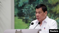 Philippines President Rodrigo Duterte delivers a speech at the start of a state dinner hosted by Singapore's President Tony Tan at the Istana in Singapore, Dec. 15, 2016.