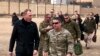 FILE - Acting Defense Secretary Pat Shanahan, left, arrives in Kabul, Afghanistan, Feb. 11, 2019, to consult with Army Gen. Scott Miller, right, commander of U.S. and coalition forces, and senior Afghan government leaders. 