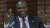 FILE - South Sudan's rebel leader Riek Machar gestures as he holds a press conference.