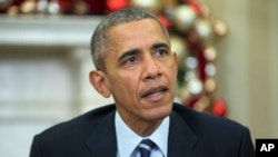 FILE - President Barack Obama makes a statement on Wednesday's mass shooting in San Bernardino, Calif., in the Oval Office of the White House in Washington, Dec. 3, 2015.