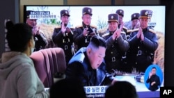 People watches a television screen showing a file image of North Korean leader Kim Jong Un during a news program at the Seoul Railway Station in Seoul, South Korea, Saturday, March 21, 2020. North Korea on Saturday fired two presumed short-range…