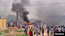 People take part in protests over fuel subsidy cuts in Khartoum, Sudan, Sept. 25, 2013. As many as 185 people are thought to have been killed in a crackdown against anti-austerity protests in Khartoum three years ago.