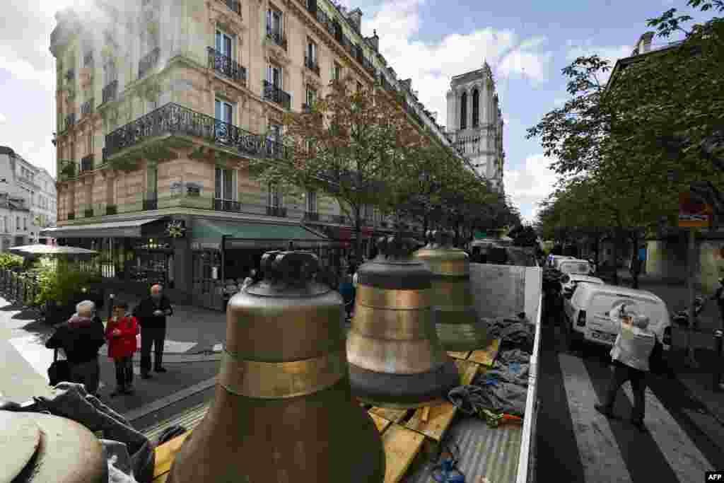 Eight bells of the north belfry of Notre-Dame de Paris cathedral arrive in central Paris, less than three months before the cathedral reopens. 
