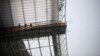 FILE - Laborers work at the Incheon Asiad Main Stadium that is being built for the 17th Asian Games in Incheon, South Korea, April 2014.