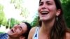 Two people laughing.