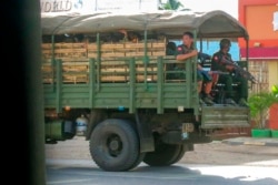 FILE - Military troops and police go on patrol at Kayah state, eastern Myanmar, May 23, 2021.