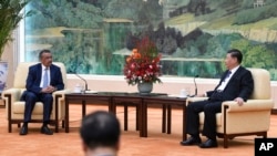 Tedros Adhanom, director general of the World Health Organization, left, meets with Chinese President Xi Jinping at the Great Hall of the People in Beijing, Jan. 28, 2020. 