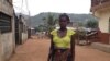 Isatu Gbankay, six months pregnant, stands outside a friend's home in Freetown, Sierra Leone, April 8, 2015. (Nina deVries/VOA)