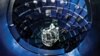 FILE - Technicians use a service system lift to access the target chamber interior for inspection and maintenance at the National Ignition Facility (NIF), at Lawrence Livermore National Laboratory federal research facility in Livermore, Calif., in 2008. 