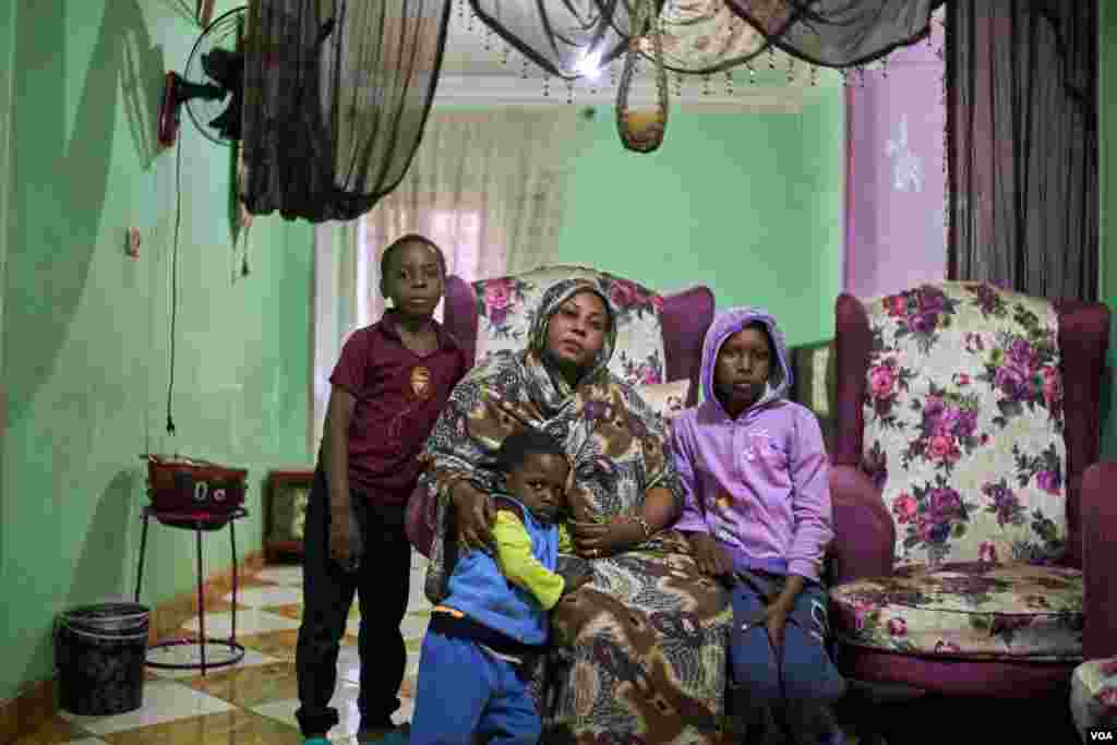 Eman, from the Nuba Mountains in South Kordofan, Sudan. Her husband left her and she says, "It is hard to find a proper job here. ... Life is expensive here; that is why I stopped sending my children to schools." In Cairo. (H. Elrasam/VOA)