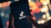 一部iPhone手机上显示TikTok应用程序的图标。