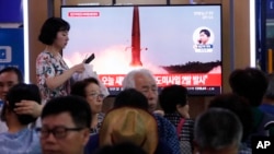 A TV at the Seoul Railway Station shows a file image of North Korea's missile launch during a news program, in Seoul, South Korea, Wednesday, July 31, 2019. North Korea fired two short-range ballistic missiles off its east coast Wednesday, South…