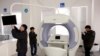FILE - Workers assemble a HRA medical screening machine a the factory of the Huisianpu Medical Systems in Qinhuangdao in the QHD economic development zone, Hebei province, China, Dec. 2, 2016. 