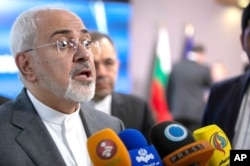 Iranian Foreign Minister Javad Zarif speaks with the media after a meeting with European Union foreign policy chief Federica Mogherini at the Europa building in Brussels, May 15, 2018.
