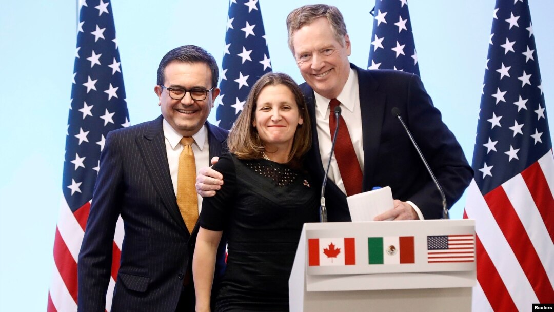FILE - Mexican Economy Minister Ildefonso Guajardo, Canadian Foreign Minister Chrystia Freeland and U.S. Trade Representative Robert Lighthizer smile during a joint news conference on the closing of the seventh round of NAFTA talks in Mexico City, Mexico, March 5, 2018.
